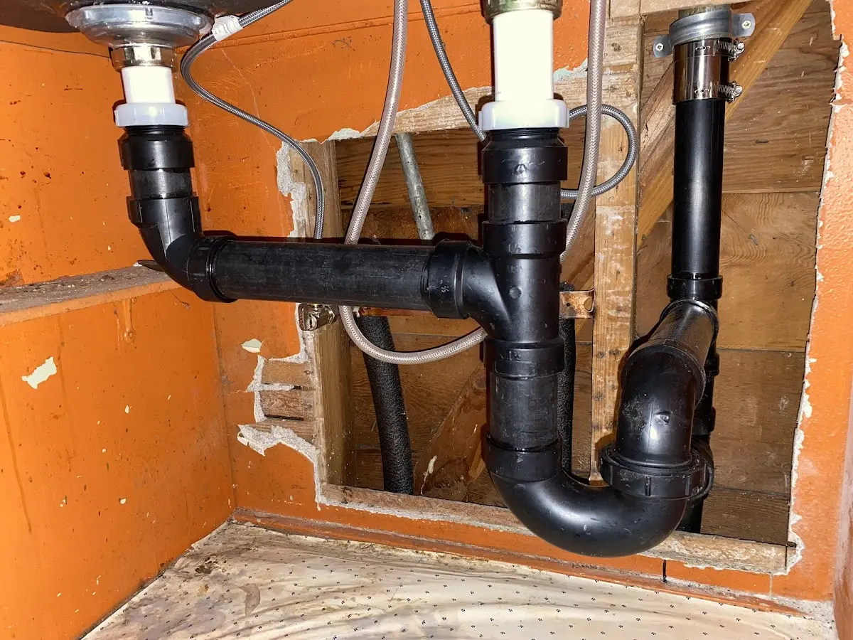 Professional Garbage Disposal Repair equipment and tools on the job in Russell